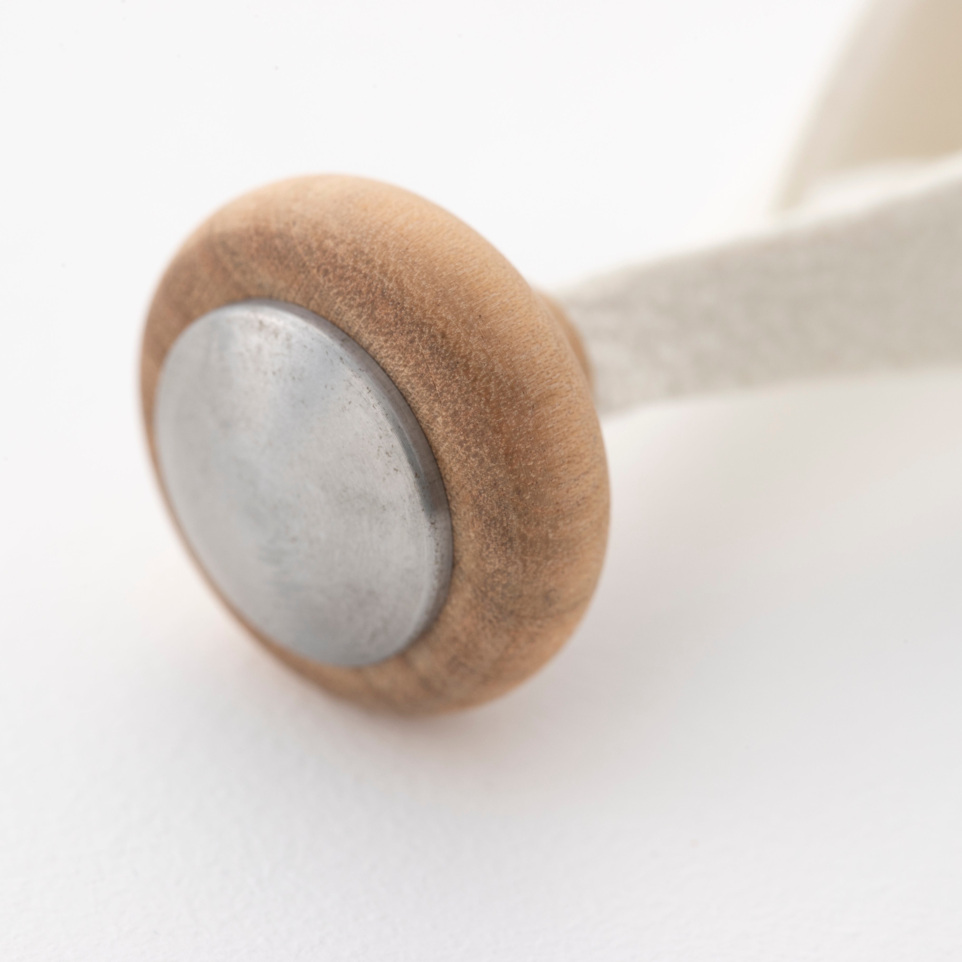 Close-up detail of the Tailo wooden mallet handle showing high-quality craftsmanship
