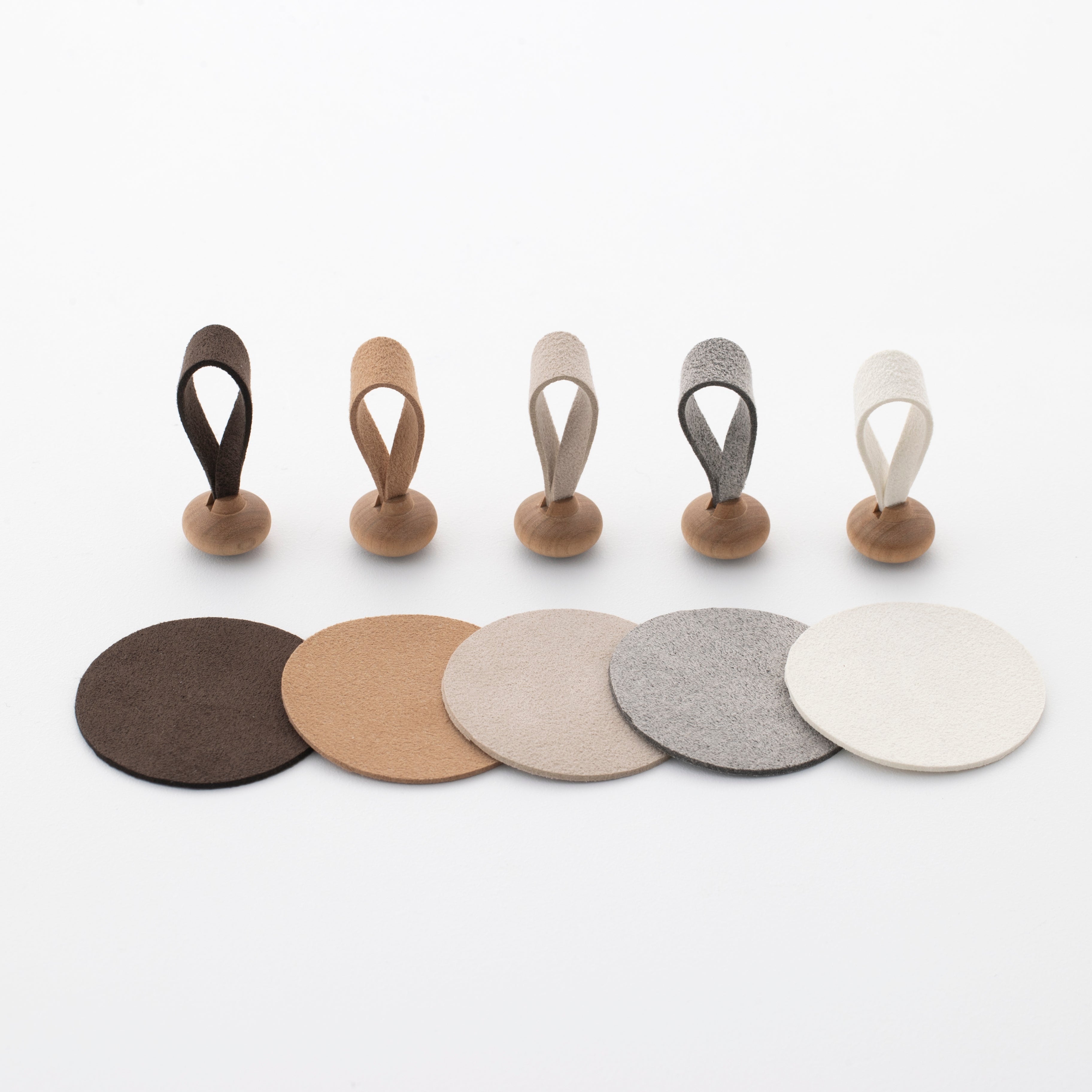 Five color variations of mallets and mats for Tailo pet memorial bell: Chocolate, Tan, Cream, Mixed Gray, and White